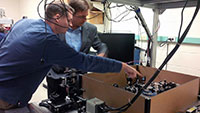 Keith Lidke, PhD, explains his current research to Senator Heinrich in the Lidke Lab Future Faces of Physics