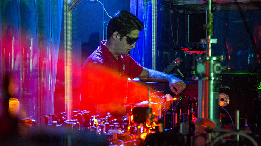 Aram Gragossian tests lasers in Sheik-Bahae lab at Physics & Astronomy building
